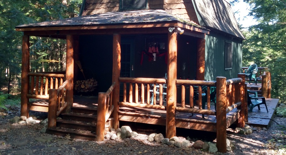 Covered porch w/ log railings